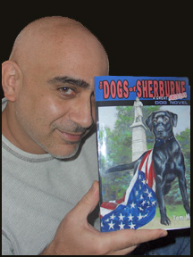 Author Tom MOdy holding his novel The Dogs of Sherburne 